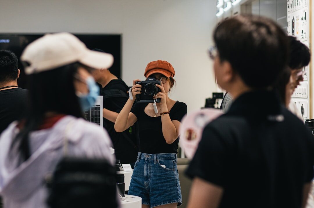 Diverse group of students reviewing photo contact sheets in a workshop